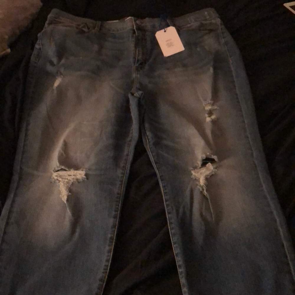 Skinny mid washed distressed jeans.